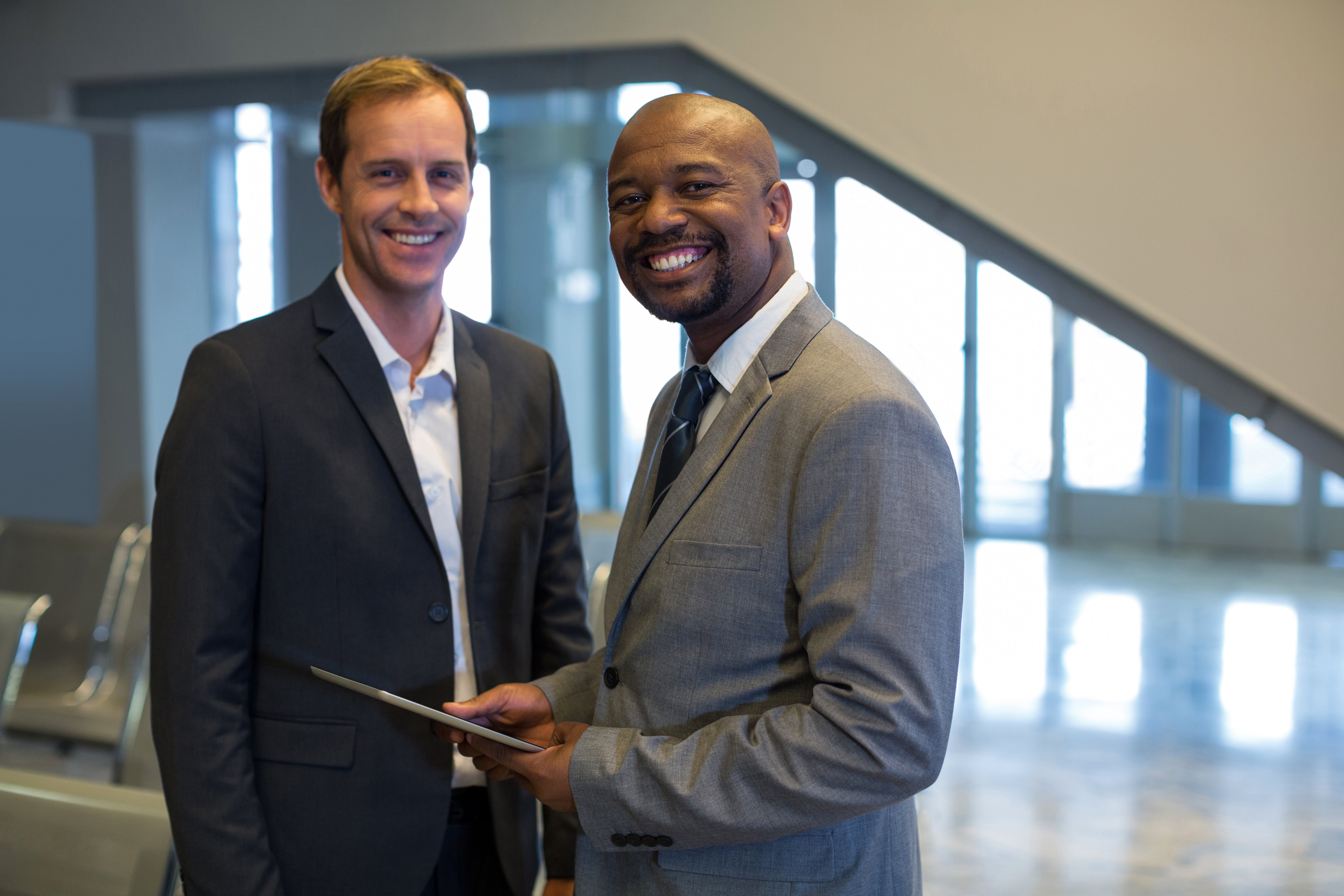 business-people-using-digital-tablet-airport